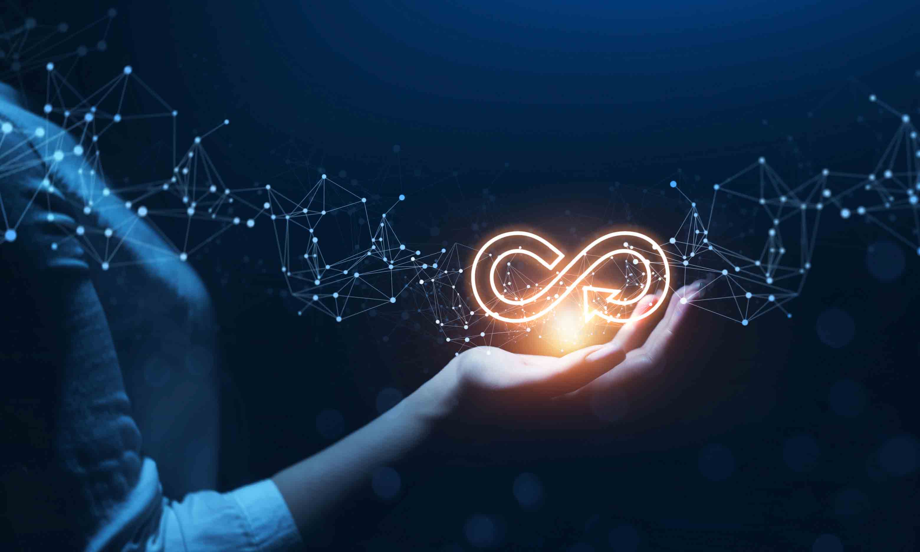 Person holding infinity symbol